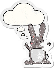 cartoon rabbit with thought bubble as a distressed worn sticker