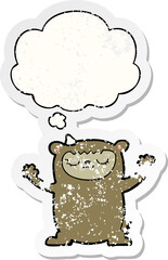 cute cartoon bear with thought bubble as a distressed worn sticker