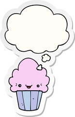 cartoon cupcake with face with thought bubble as a printed sticker