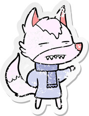 distressed sticker of a cartoon wolf in winter clothes