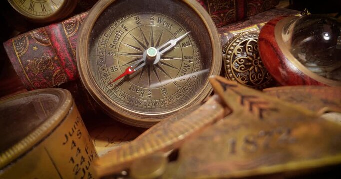 Vintage style travel and adventure. Vintage old compass and other vintage items on the table.