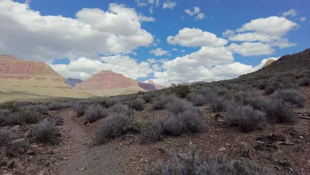 Hiking North On Tonto Trail Under Puffy Clouds in the Grand Canyon