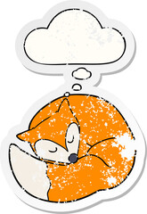 cartoon sleeping fox with thought bubble as a distressed worn sticker