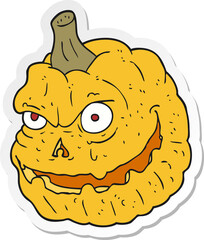 sticker of a cartoon spooky pumpkin