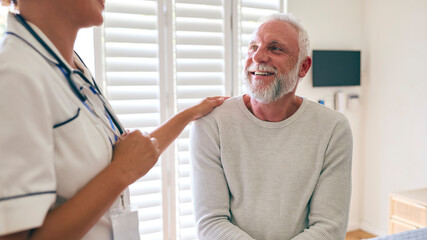 Obraz premium Female Nurse Wearing Uniform Meeting With Senior Male Patient's Chest In Private Hospital Room