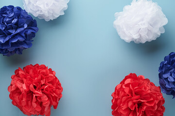 4th of July background. USA paper fans, Red, blue, white stars and confetti on blue wall background. Happy Labor Day, Independence Day, Presidents Day. American flag colors. Mock up. Top view.