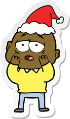 hand drawn sticker cartoon of a tired bald man wearing santa hat