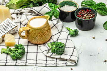 cooking background with cream, parmesan cheese, basil and spices banner, menu, recipe place for text, top view