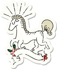 worn old sticker of a tattoo style prancing stallion