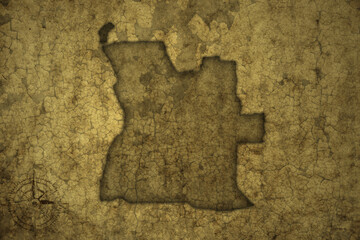 map of angola on a old vintage crack paper background .