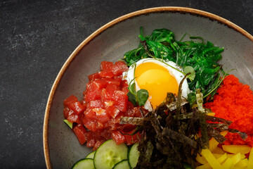 pibimpap with flying fish roe, meat, fish, and nori