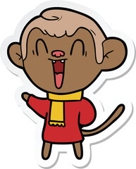 sticker of a cartoon laughing monkey