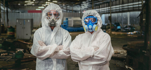 chemical specialist wear safety uniform and gas mask inspecting chemical leak in industry factory