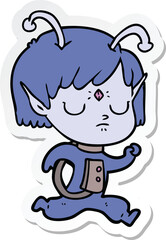 sticker of a cartoon alien girl