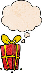 cartoon xmas present with thought bubble in grunge texture style