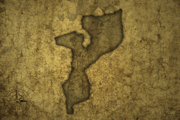 map of mozambique on a old vintage crack paper background .