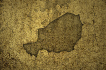 map of niger on a old vintage crack paper background . - obrazy, fototapety, plakaty