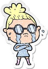 distressed sticker of a cartoon crying woman wearing spectacles