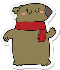 sticker of a cartoon bear with scarf