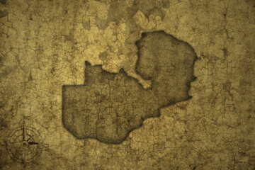 map of zambia on a old vintage crack paper background .