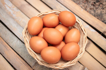 Chicken eggs in a wicker basket