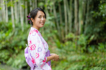Woman wear kimono in the park
