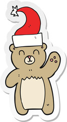 sticker of a cartoon teddy bear waving