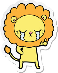 sticker of a crying cartoon lion
