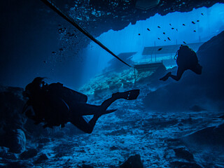 Sunlight illuminating the underwater cavern entrance in the sinkhole at Blue Grotto, Florida