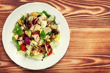 Plate of fresh tasty salad with cheese