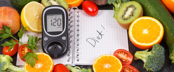 Word diet written in notepad, glucometer and fruits with vegetables, diabetes and healthy lifestyles concept