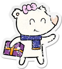 distressed sticker of a female polar bear with christmas present