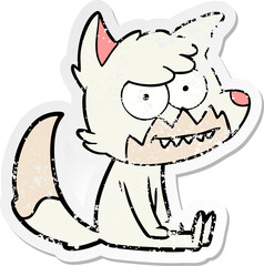 distressed sticker of a cartoon grinning fox