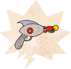 cartoon ray gun with speech bubble in grunge distressed retro textured style