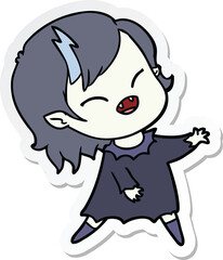 sticker of a cartoon laughing vampire girl