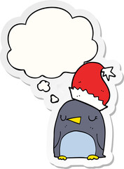 cute christmas penguin with thought bubble as a printed sticker