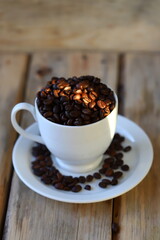 Roasted coffee beans. Wooden background.