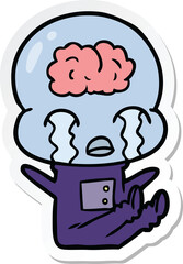 sticker of a cartoon big brain alien crying