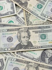 Several $20, $1 and $2 Bills Close Up on Surface