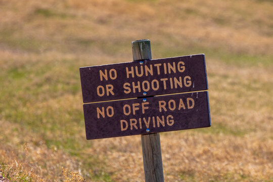 No Hunting or Shooting and No Off Road Driving sign in Badlands National Park.
