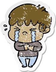 distressed sticker of a cartoon boy crying