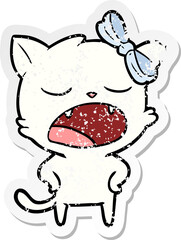 distressed sticker of a cartoon yawning cat