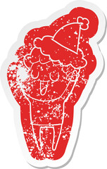 laughing quirky cartoon distressed sticker of a man wearing santa hat