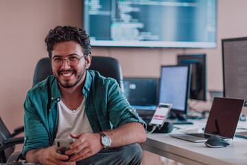 A programmer diligently testing smartphone applications while sitting in their office.
