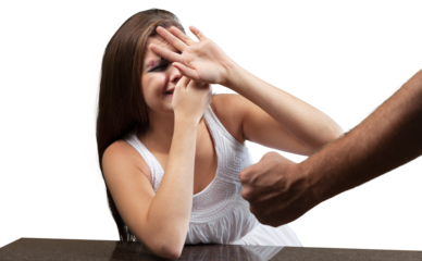 Woman covering face in fear of domestic violence