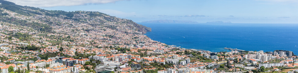 Fototapeta na wymiar Full panoramic aerial view of the city of Funchal and Camara de Lobos, tourist and iconic city on the island of Madeira, in Portugal