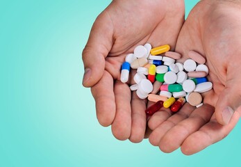 Dietary supplement concept, young hand hold pills