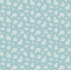 Cute floral pattern in the small flowers. Seamless vector texture. Elegant template for fashion prints. Printing with small white flowers. Light blue background. Stock print.
