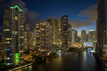 Aerial view of downtown district of of Miami Brickell in Florida, USA. Brightly illuminated high skyscraper buildings in modern american midtown