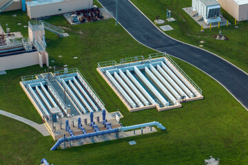 Aerial view of water treatment factory at city wastewater cleaning facility. Purification process...